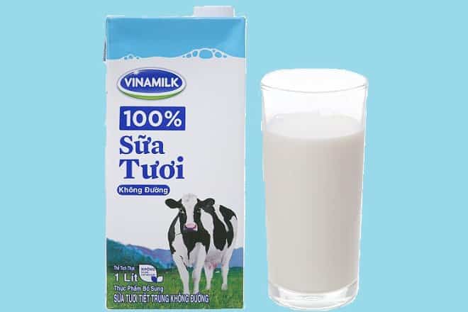 Hộp và ly sữa tươi không đường Vinamilk